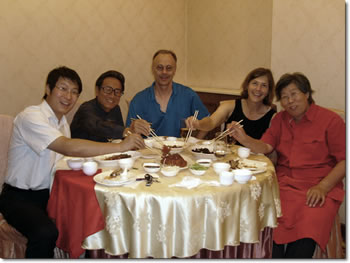 Robert and wife with host family
